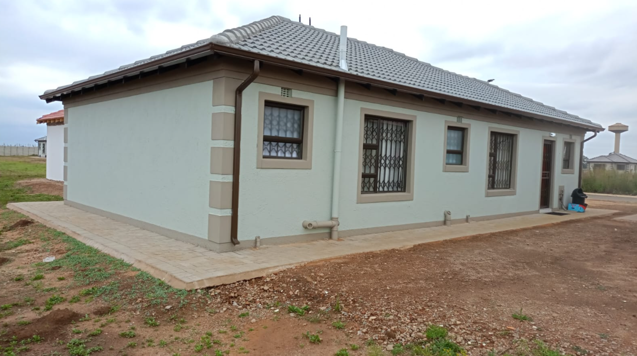 Classic Protea three-bedroom layout in pale sage plaster, photographed late afternoon.